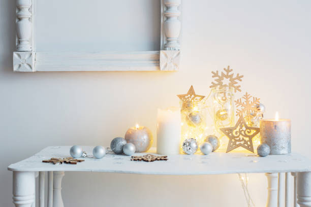 istock Christmas decoration with candles on background  white wall 872585830