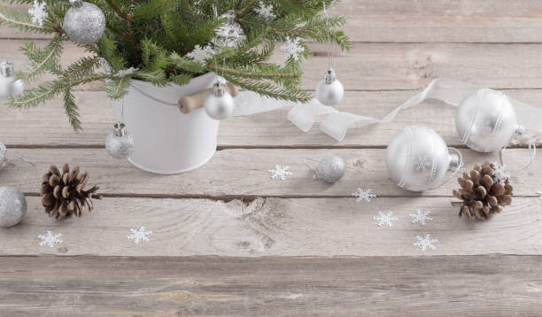istock Christmas balls and cones on dark wooden background 872585864