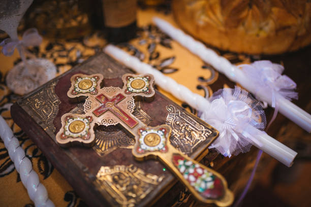 Close up of priest reading the holy bible. Priest during christening ceremony. Bible and icon. Religious concept. Ortodox religion. Ceremony in orthodox church