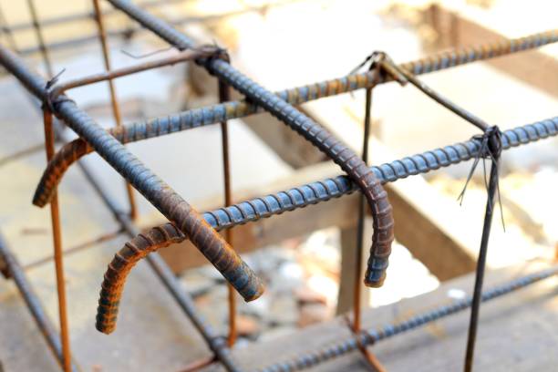 istock Reinforcement of concrete work.Using steel wire for securing steel bars with wire rod for reinforcement of concrete or cement. 872590768