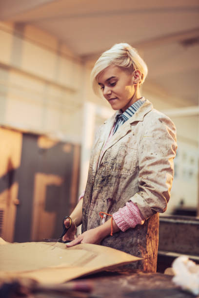 istock Printing and etching -  talented woman is making etching artworks 872593150
