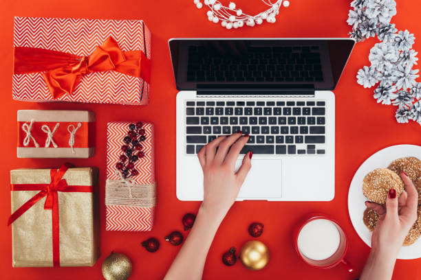 istock christmas gifts and laptop 872593692