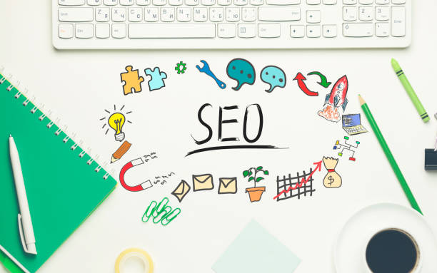 istock seo with keyboard and stationary on table 872593968