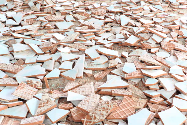 white ceramics fragments were scattered on the floor. - pottery shard imagens e fotografias de stock