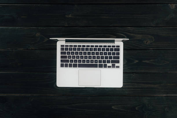 istock laptop on wooden tabletop 872594988