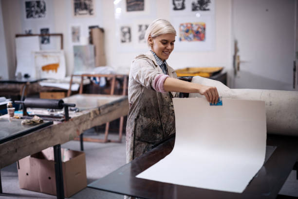 istock Beautiful young determined entrepreneur working in printing shop 872596808