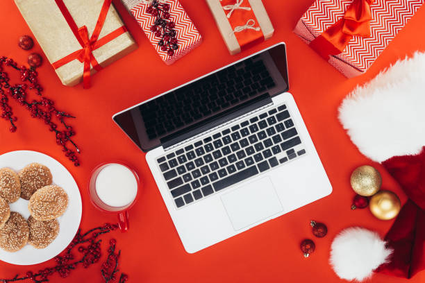 istock christmas gifts and laptop 872597450