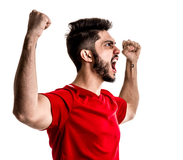 istock Fan / Sport Player on red uniform celebrating on white background 872597526
