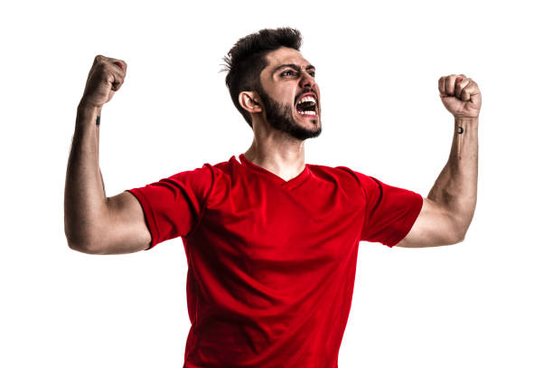 istock Fan / Sport Player on red uniform celebrating on white background 872597528