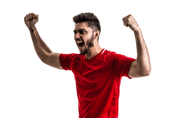istock Fan / Sport Player on red uniform celebrating on white background 872597534