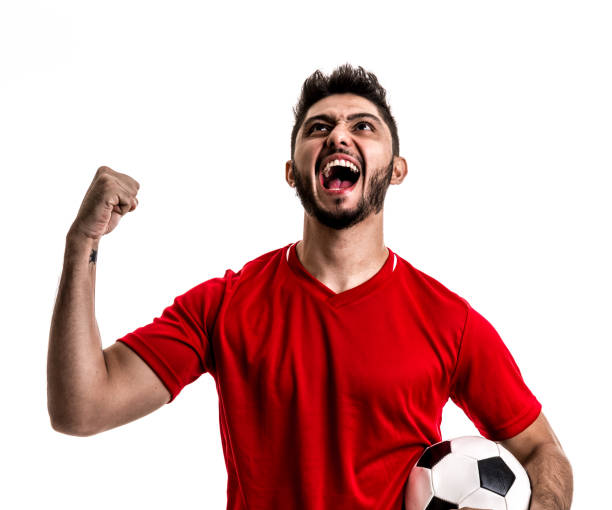istock Fan / Sport Player on red uniform celebrating on white background 872597548
