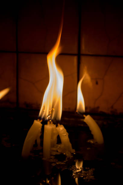 istock Burning candles give light in the dark 872600156