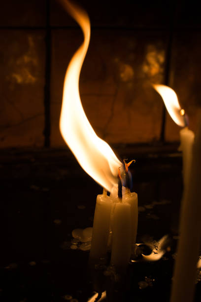 istock Burning candles give light in the dark 872600180