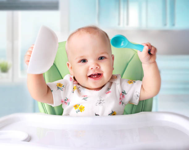istock Baby eating,child's nutrition. 872600810