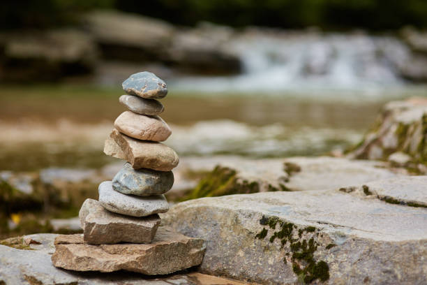 istock Stones arranged zen-like by the river 872601080