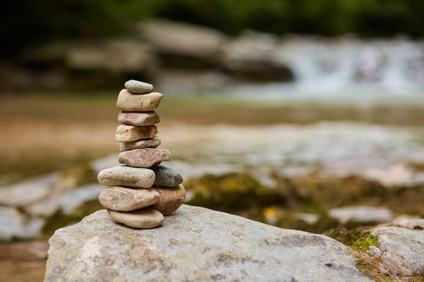 istock Stones arranged zen-like by the river 872601086