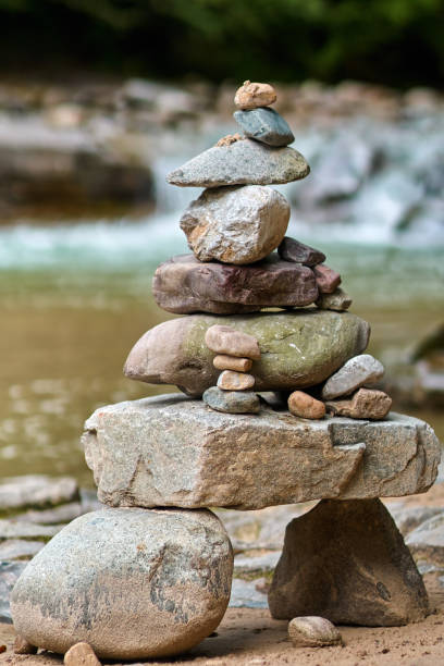 istock Stones arranged zen-like by the river 872601124