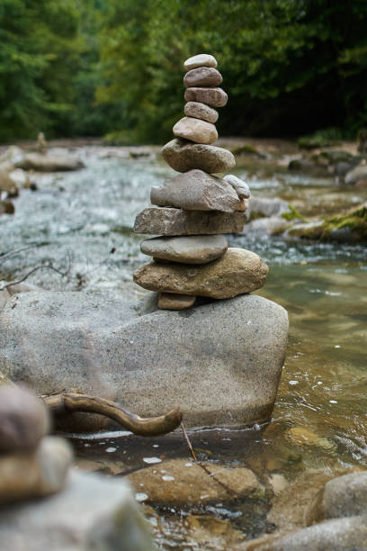 istock Stones arranged zen-like by the river 872601142
