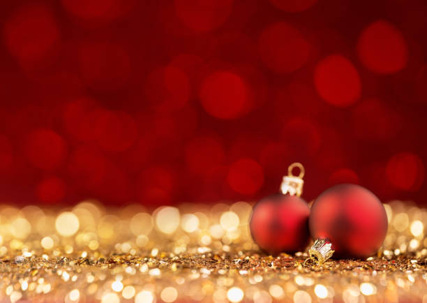 istock Two Christmas Balls on glittering surface 872604710