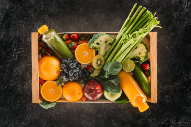 istock detox drinks and healthy food in box 872616000
