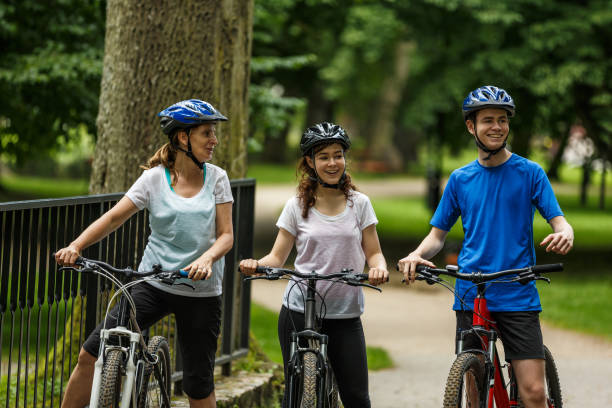 istock Urban biking- three people riding bikes in city 872618474