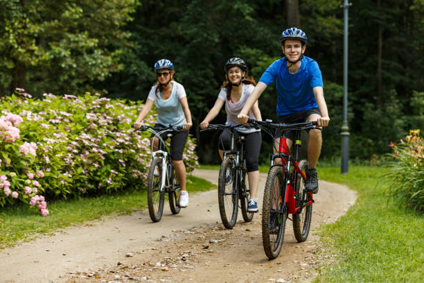 istock Urban biking- three people riding bikes in city 872618558