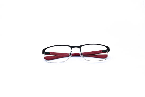 istock Pair of red and black folded spectacles, on white background 872618668