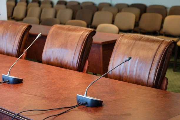 istock Table microphones at the conference hall 872619466