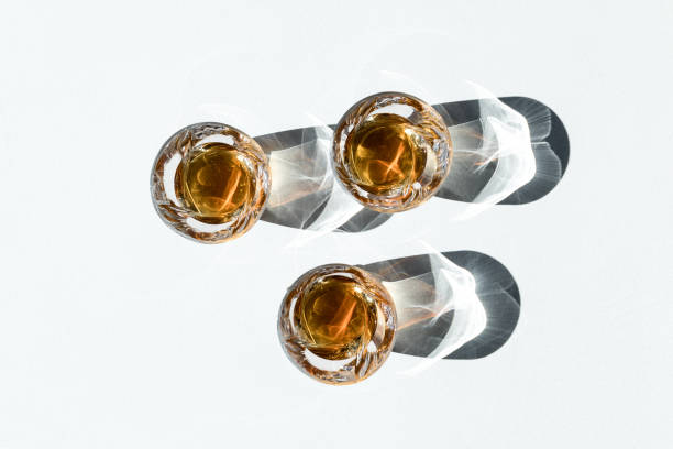 istock whiskey in glasses with shadows 872622104