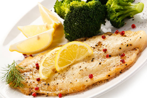 istock Fish dish - fish fillet and vegetables 872624560