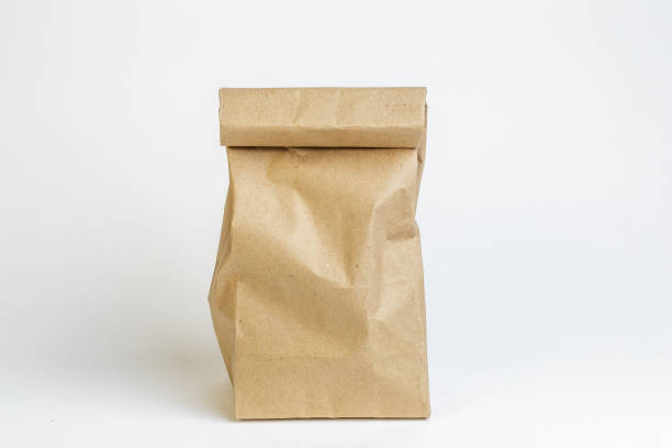 Craft paper bag on white background, not isolated Craft paper bag on white background, not isolated. Packaging mockup bag lunch stock pictures, royalty-free photos & images