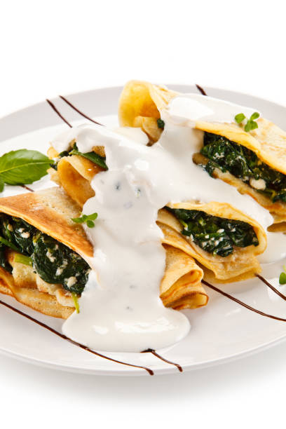 istock Crepes with spinach and cream 872625298