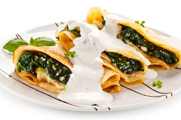 istock Crepes with spinach and cream 872625560