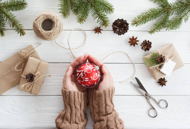 istock woman hands and christmas ball 872628226