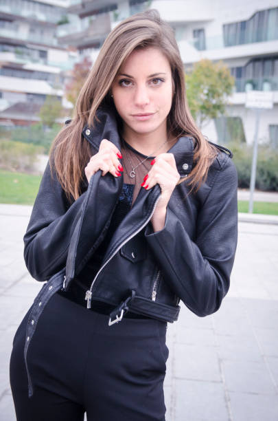 istock Girl in black jacket causal 872628416