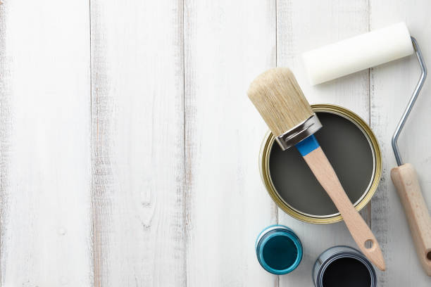 istock Different painting supplies on white wooden table 872630898