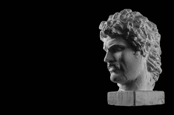 istock White plaster bust sculpture portrait of a young man with a mustache 872630946