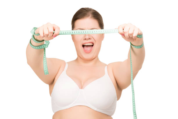 istock woman with measuring tape 872631150
