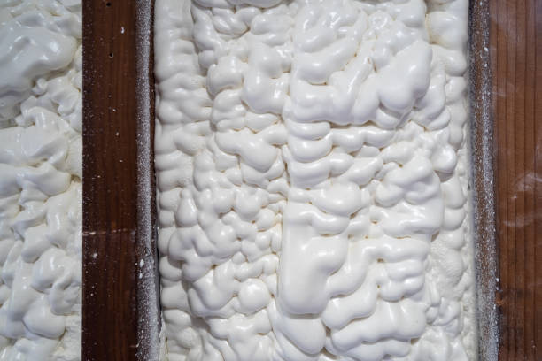 Closed cell spray foam insulation stock photo