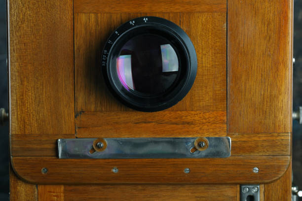 istock Vintage wooden camera on a cement background. 872631870