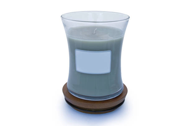 istock Perfume candle on wooden protective base with white background 872632030