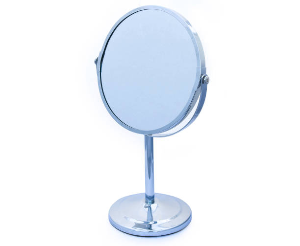 istock Titling circular hinged chrome framed vanity mirror for makeup or shaving etc on white background 872632032