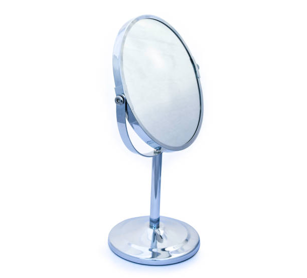 istock Titling circular hinged chrome framed vanity mirror for makeup or shaving etc on white background 872632048
