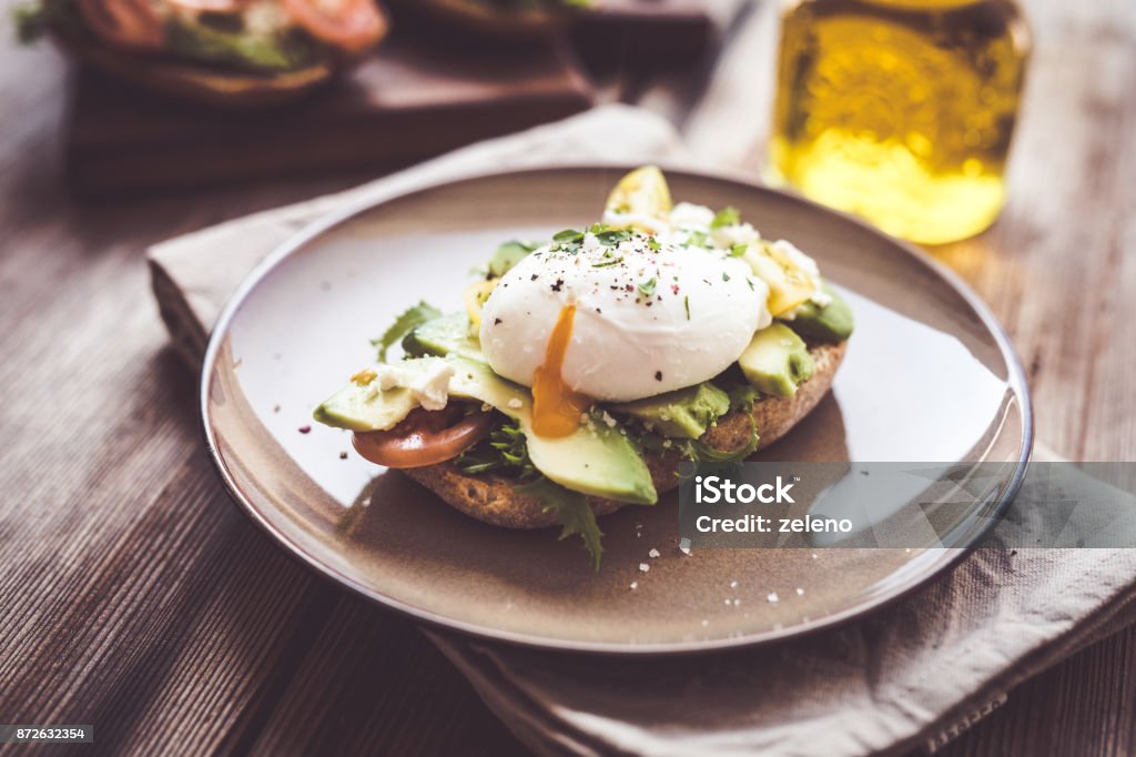 Sandwich with avocado and poached egg Egg - Food Stock Photo