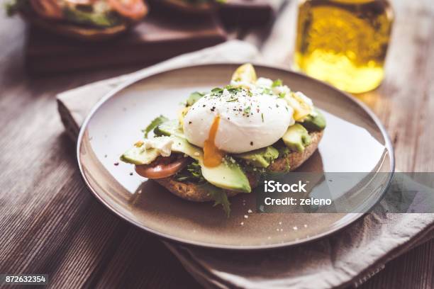 Sandwich With Avocado And Poached Egg Stock Photo - Download Image Now - Egg - Food, Toasted Bread, Poached Food