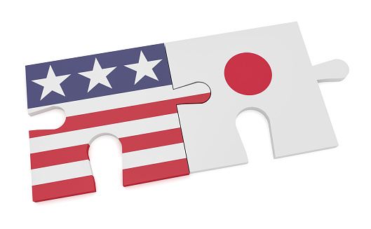 USA Japan Partnership Concept: US Flag And Japanese Flag Puzzle Pieces, 3d illustration isolated on white background