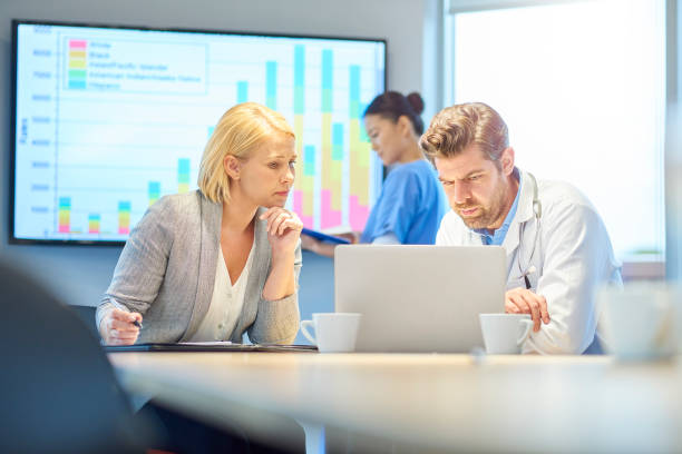 istock hospital doctor with administrator 872641584