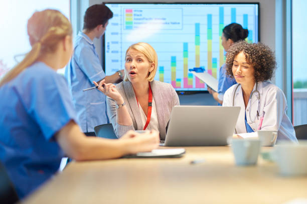 istock hospital manager with team 872641650