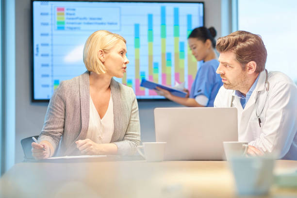istock sales rep chatting to doctor 872642774