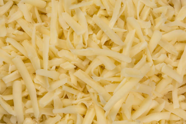 Shredded Mozzarella a closeup of shredded Mozzarella shredded mozzarella stock pictures, royalty-free photos & images